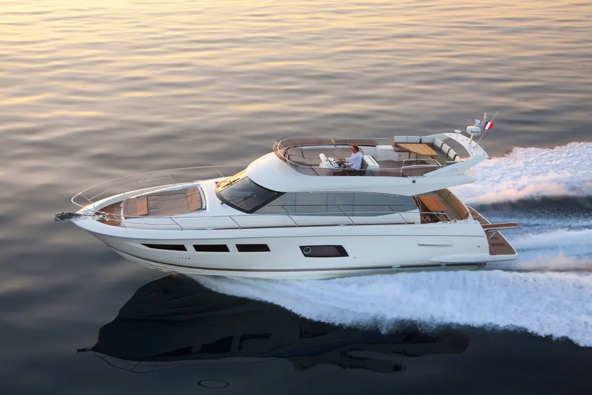 Prestige 550 FLY, exterior — Sardinia Lux Yachts, Sardinia. Flybridge afternoons and sunset runs along the coast